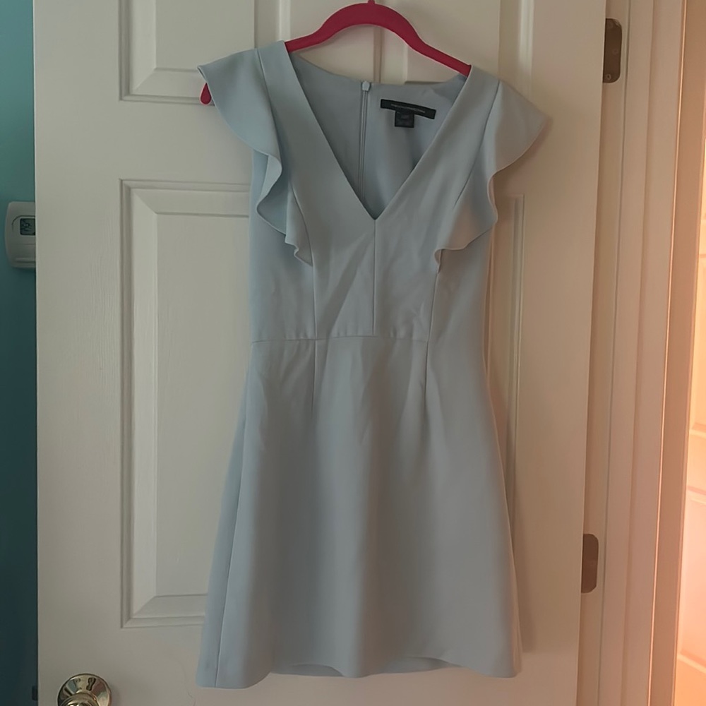 A formal mini dress. Tight fit.